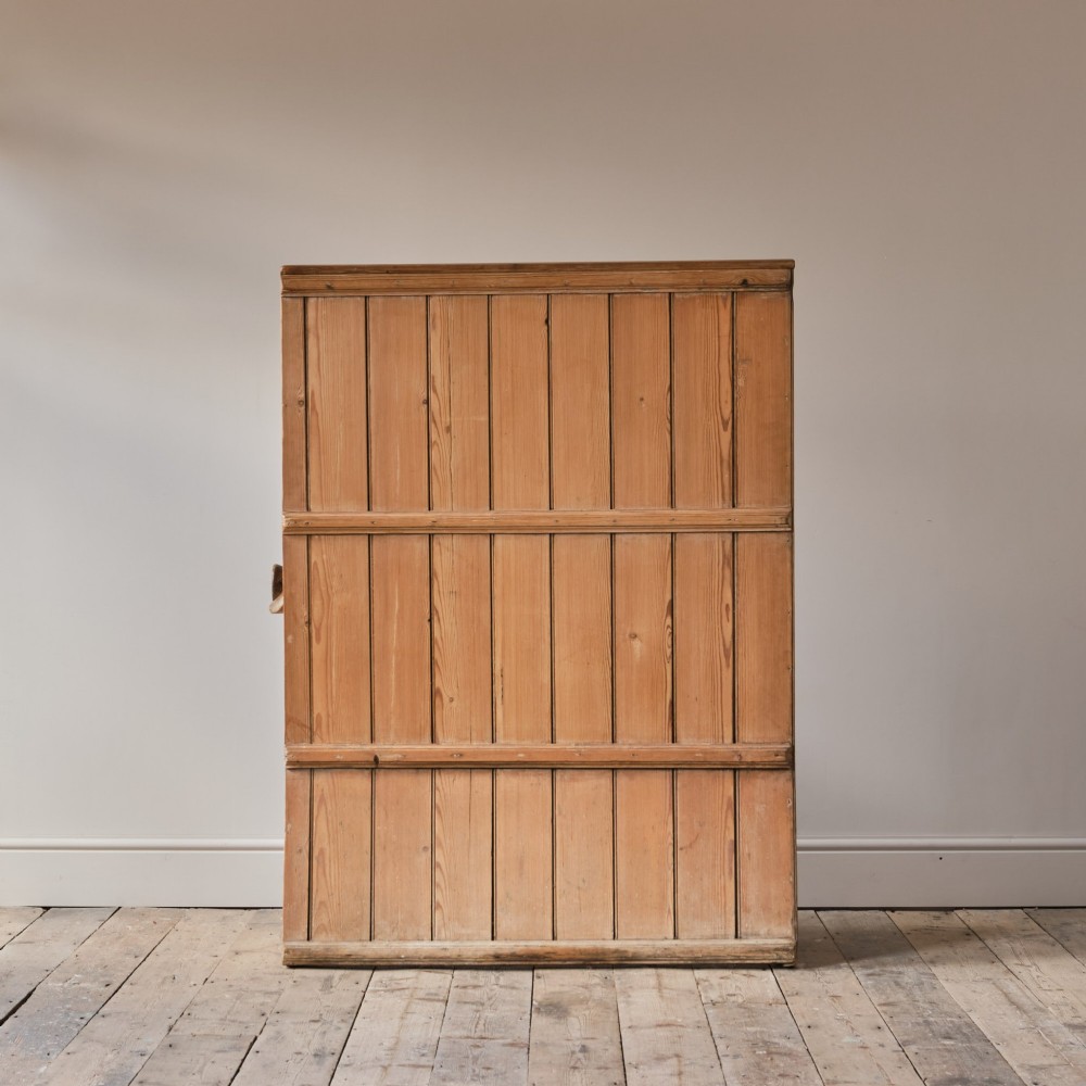 A 19th-century pine and elm high-backed settle featuring scrolled armrests and vertical plank construction. View VII