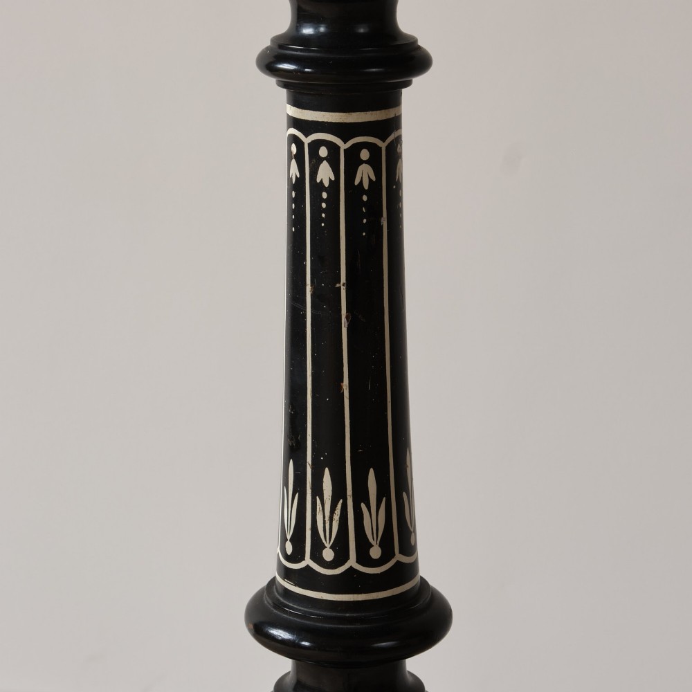 A 19th-century Aesthetic Movement ebonised tripod side table featuring a circular top, turned central column, light-coloured decorative inlay, and finial details. View IV