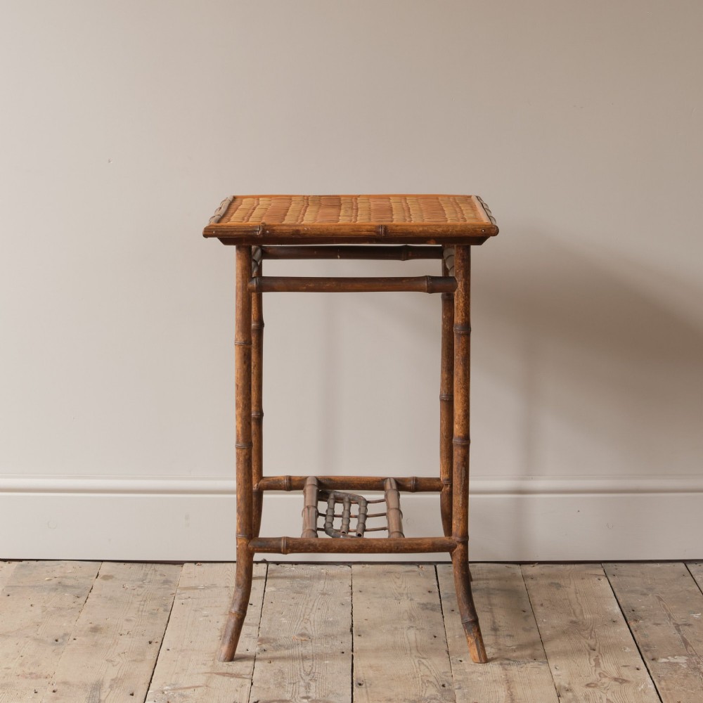 An early 20th-century bamboo side table featuring a rectangular woven cane top, bamboo legs, and lower cross stretchers. View III