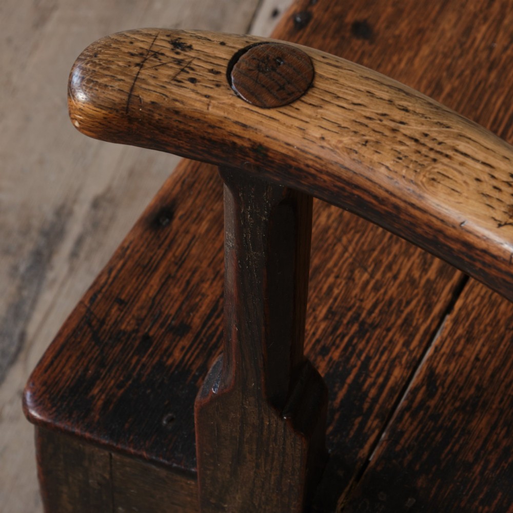 A Georgian oak open armchair featuring a vase-shaped splat back, solid seat, shaped armrests, and an H-stretcher base. View XIII