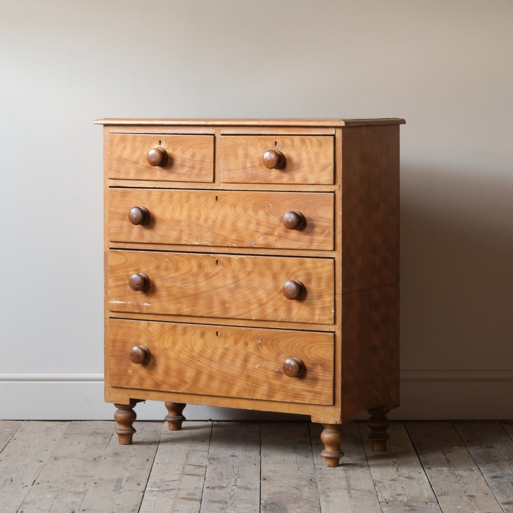 A Victorian 19th-century pine chest of drawers with a scumble painted finish, featuring two short over three long drawers with turned wooden knobs. View II