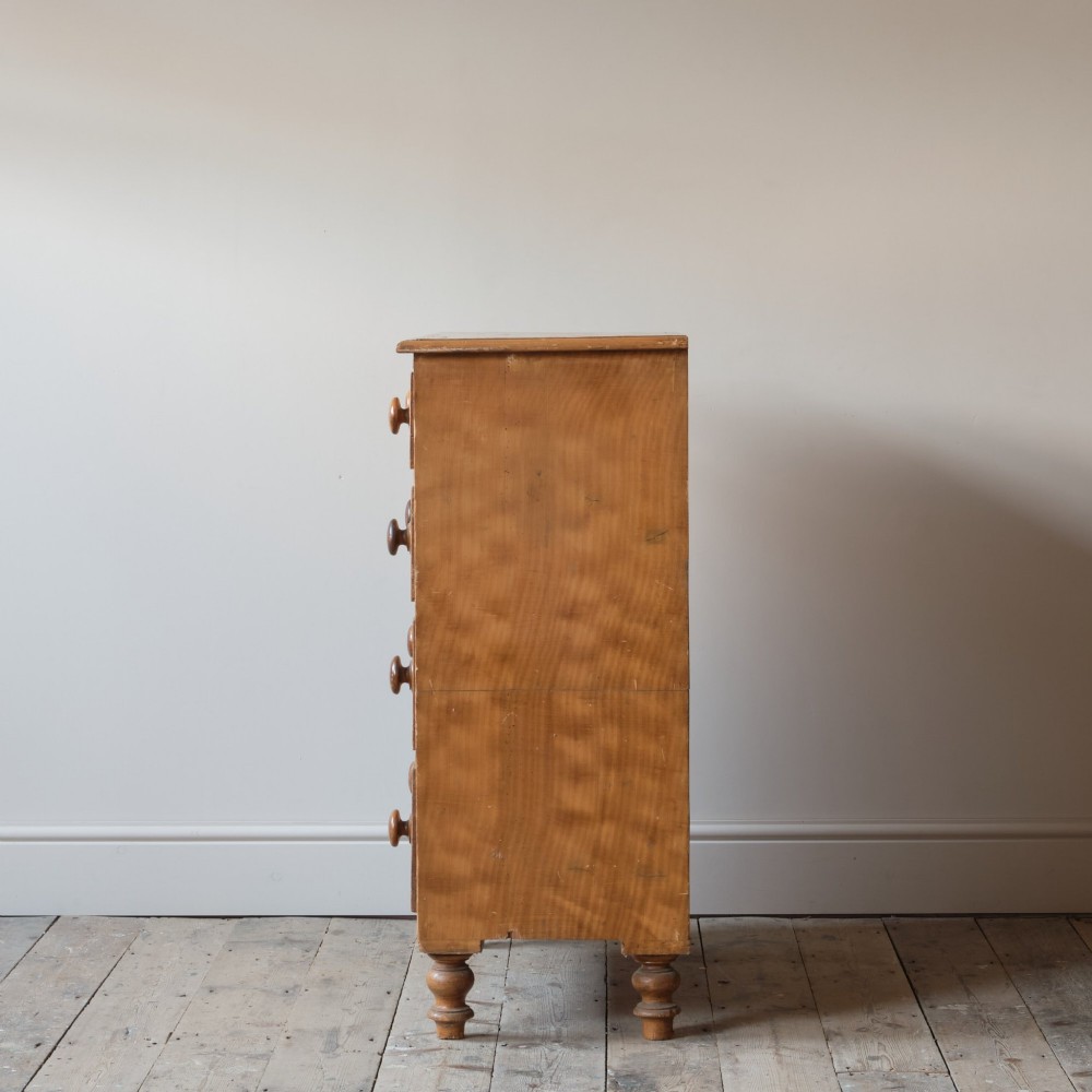 A Victorian 19th-century pine chest of drawers with a scumble painted finish, featuring two short over three long drawers with turned wooden knobs. View IV