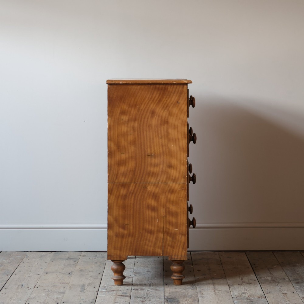 A Victorian 19th-century pine chest of drawers with a scumble painted finish, featuring two short over three long drawers with turned wooden knobs. View VI