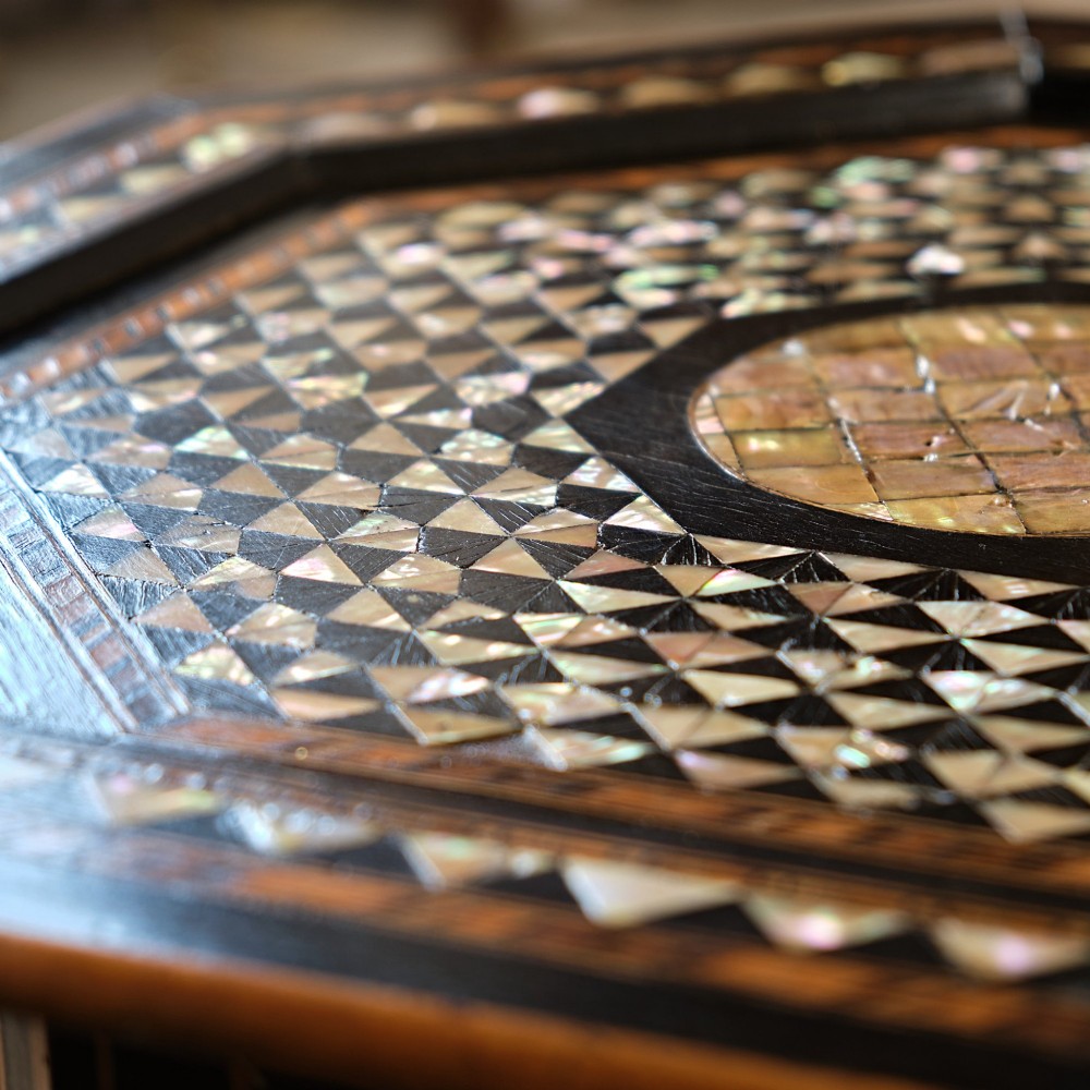 An octagonal dark ebonised wood Moorish side table featuring geometric mother-of-pearl inlay and pointed arch cut-outs along the base. View II