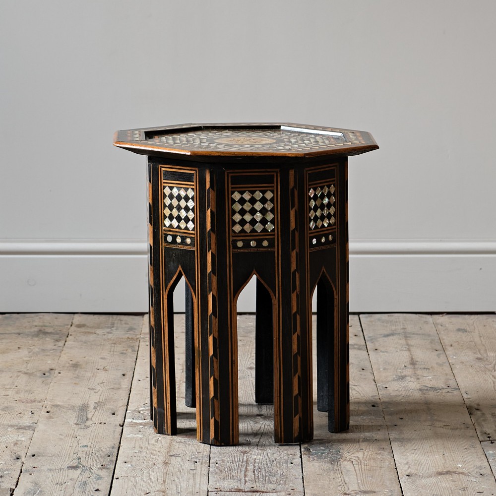 An octagonal dark ebonised wood Moorish side table featuring geometric mother-of-pearl inlay and pointed arch cut-outs along the base. View IV