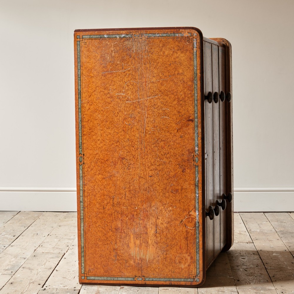 A 19th-century pine chest of drawers featuring an ochre painted finish with decorative green line borders, two short drawers over three long drawers, and turned wooden knobs. View VIII