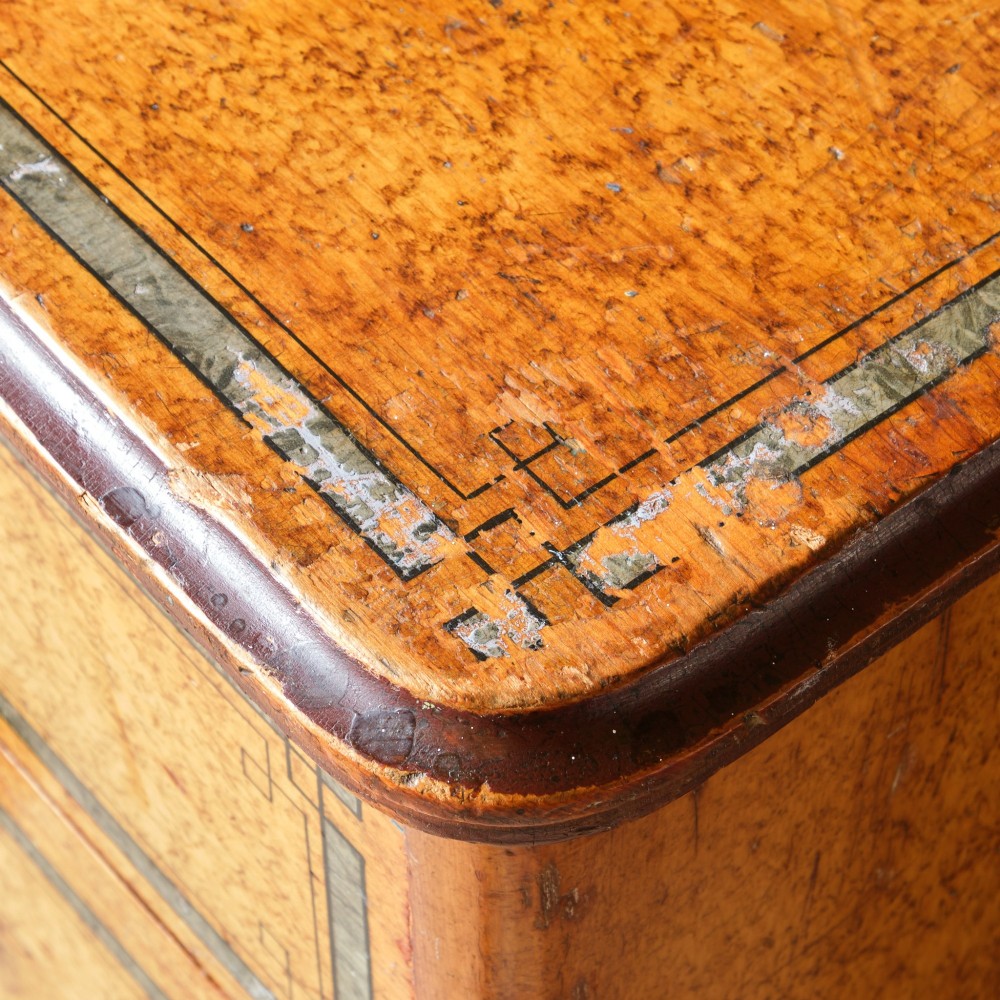 A 19th-century pine chest of drawers featuring an ochre painted finish with decorative green line borders, two short drawers over three long drawers, and turned wooden knobs. View XIII