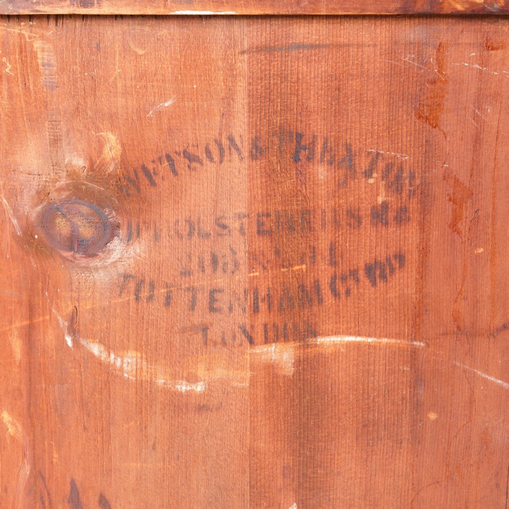 A 19th-century pine chest of drawers featuring an ochre painted finish with decorative green line borders, two short drawers over three long drawers, and turned wooden knobs. View XV