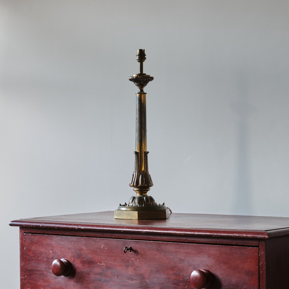 A 19th-century gilt brass table lamp base featuring a tapered central column, stylized foliage details, and an octagonal plinth base. View II