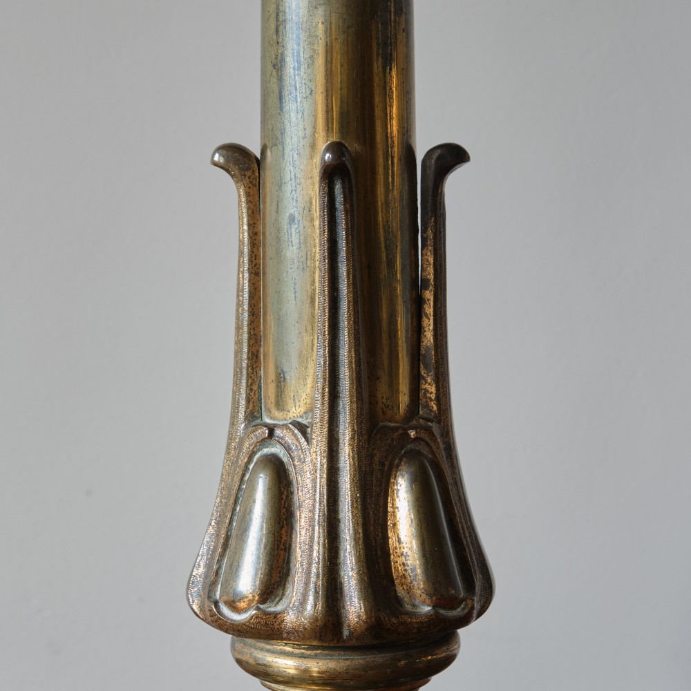 A 19th-century gilt brass table lamp base featuring a tapered central column, stylized foliage details, and an octagonal plinth base. View IV