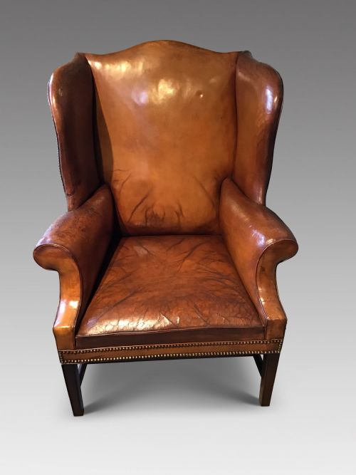 Antique Leather Upholstered Wing Chair