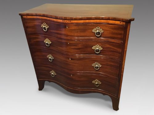 Antique serpentine chest of drawers
