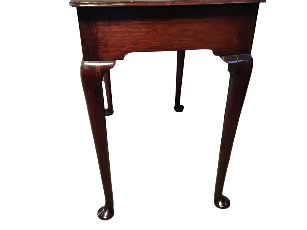 A Georgian mahogany side table featuring a single frieze drawer with a brass handle, supported by slender cabriole legs with pad feet. View III