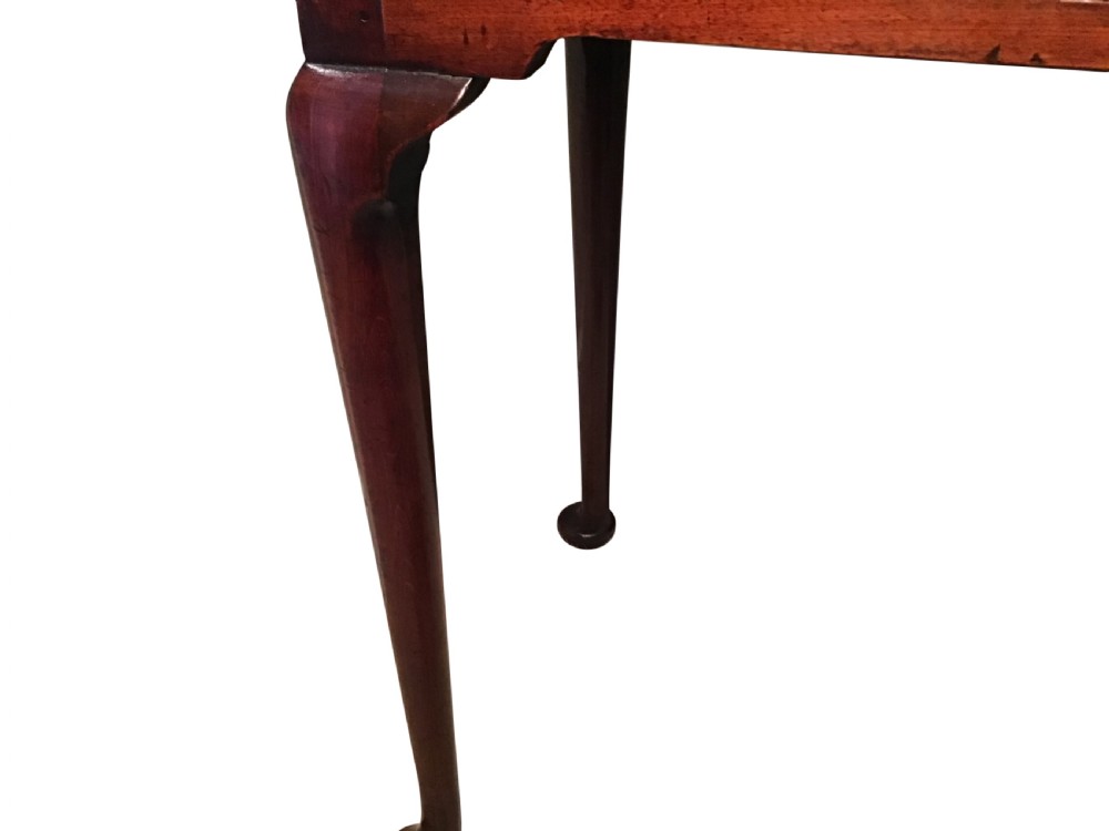 A Georgian mahogany side table featuring a single frieze drawer with a brass handle, supported by slender cabriole legs with pad feet. View VI