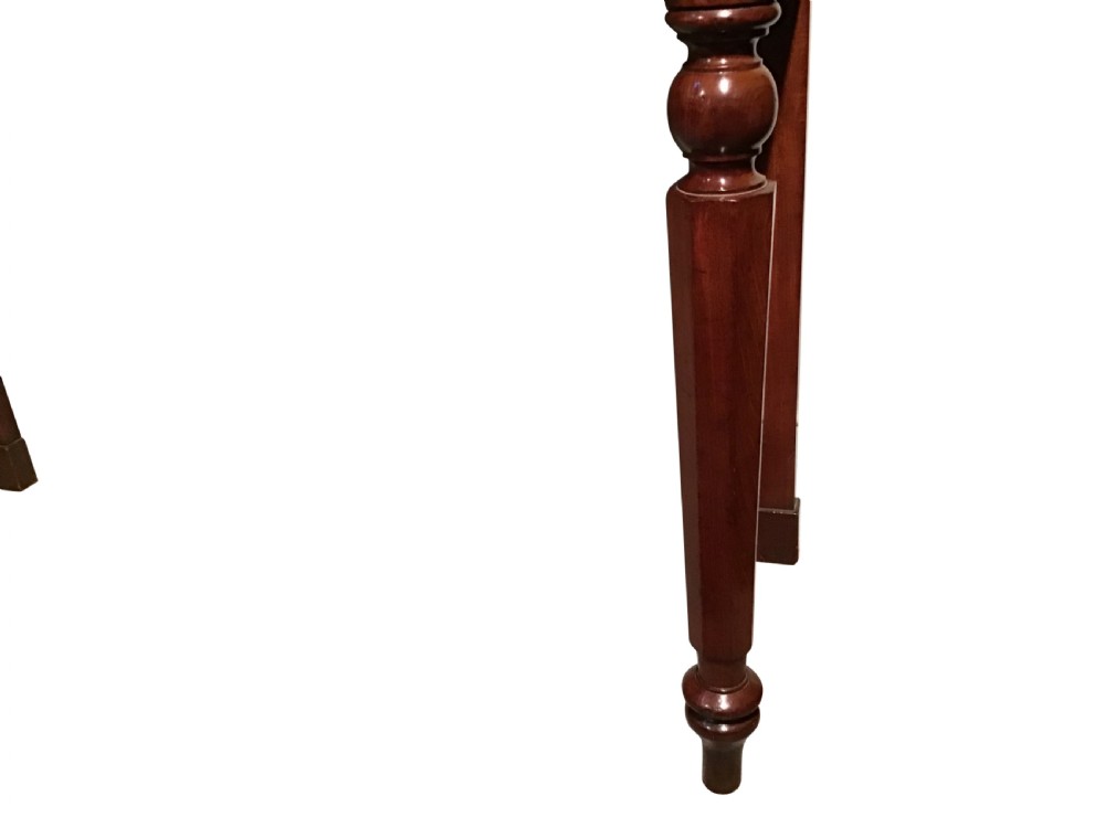 A mahogany serving table featuring a raised shaped backboard gallery, polished rectangular top, plain apron, and turned front legs. View II