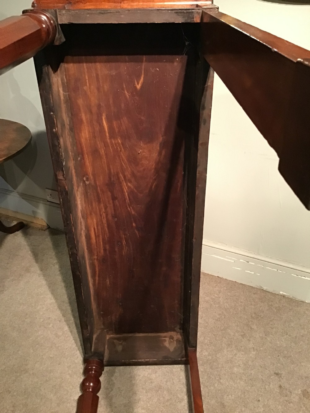 A mahogany serving table featuring a raised shaped backboard gallery, polished rectangular top, plain apron, and turned front legs. View VII
