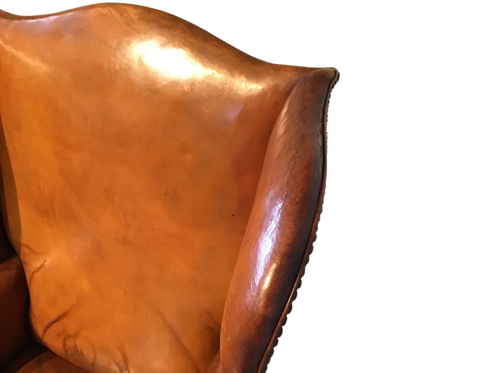 Antique leather upholstered wing chair View IV