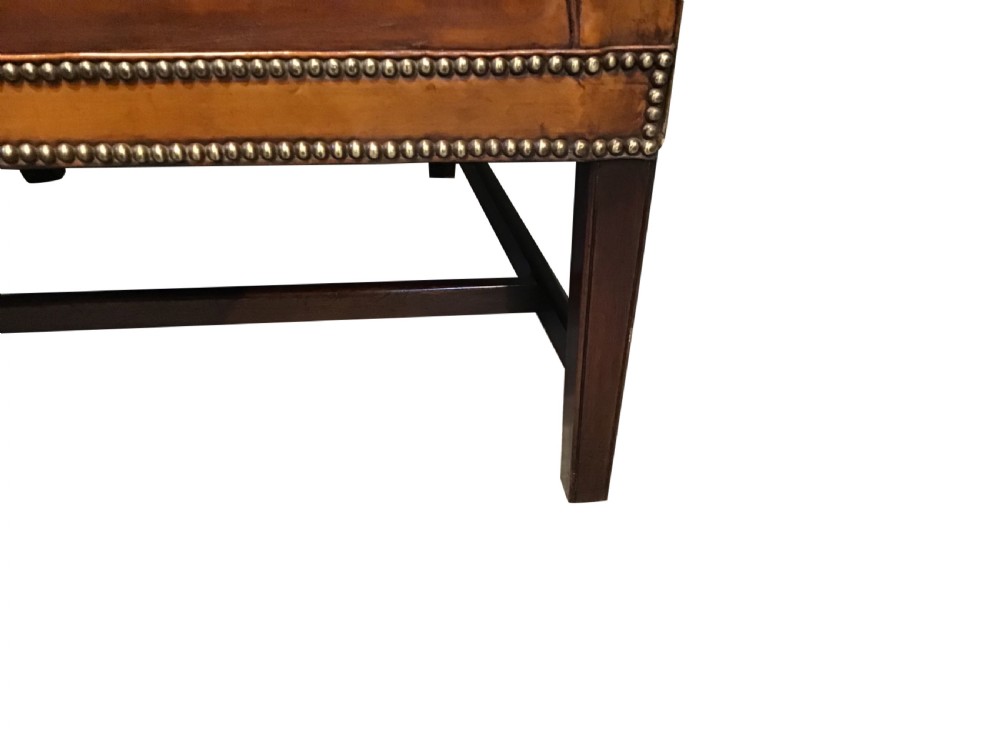 Antique leather upholstered wing chair View IX