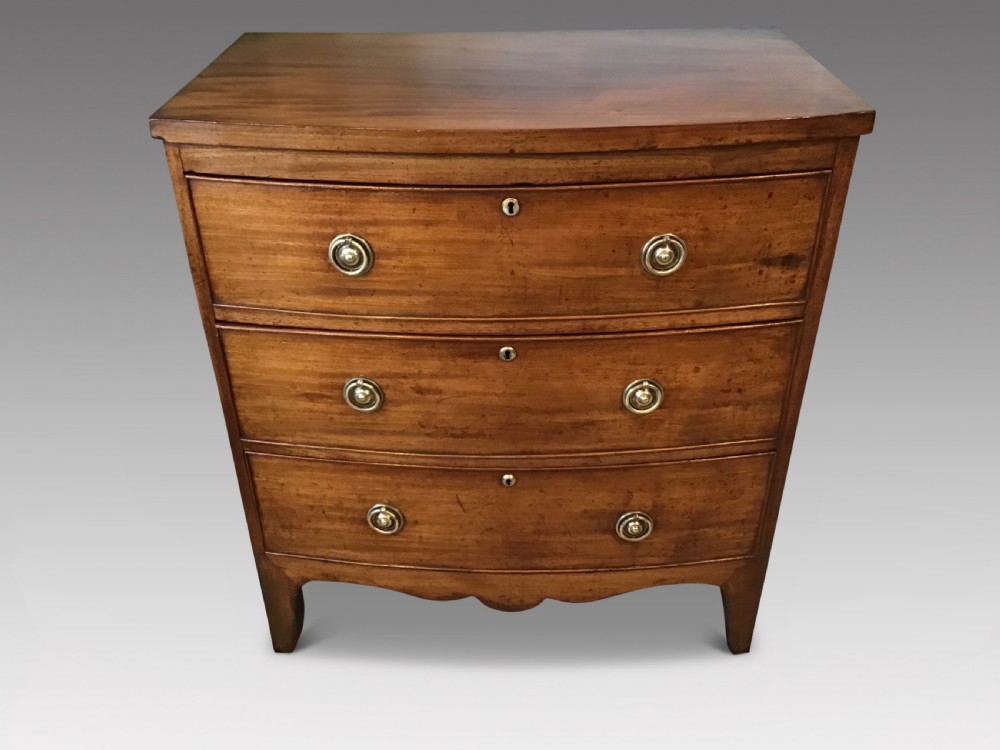 Antique bow front chest of drawers.