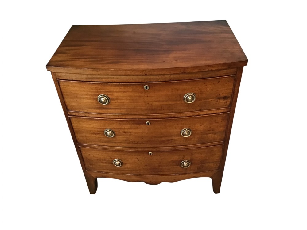 Antique bow front chest of drawers. View II