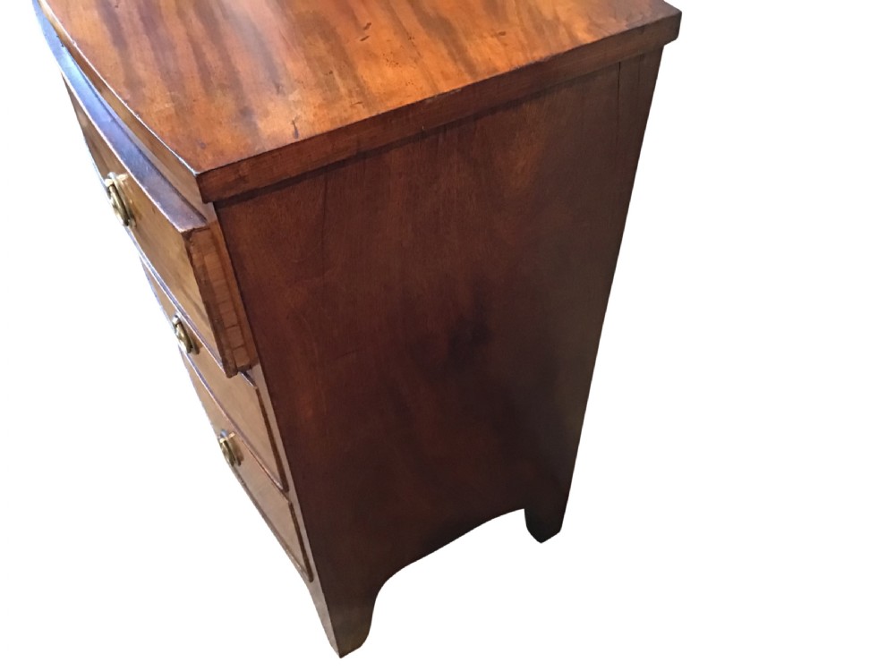 Antique bow front chest of drawers. View III