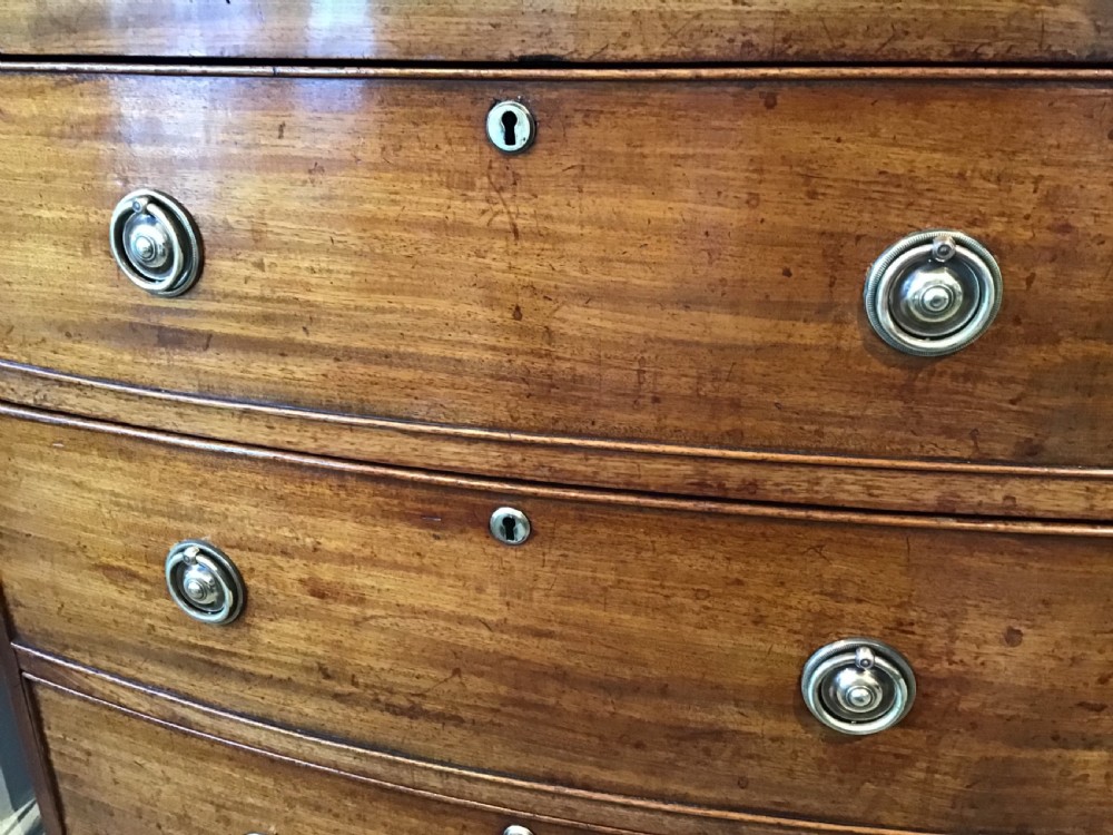 Antique bow front chest of drawers. View VII