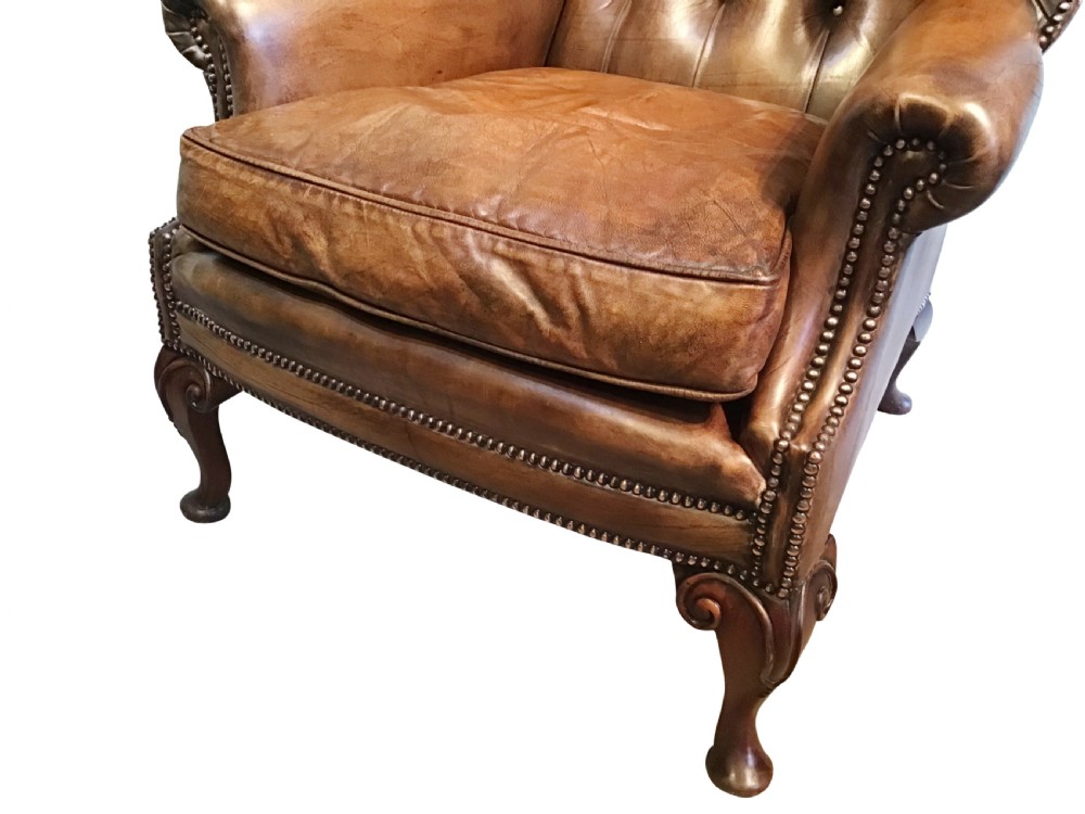 Antique leather wing chair View III