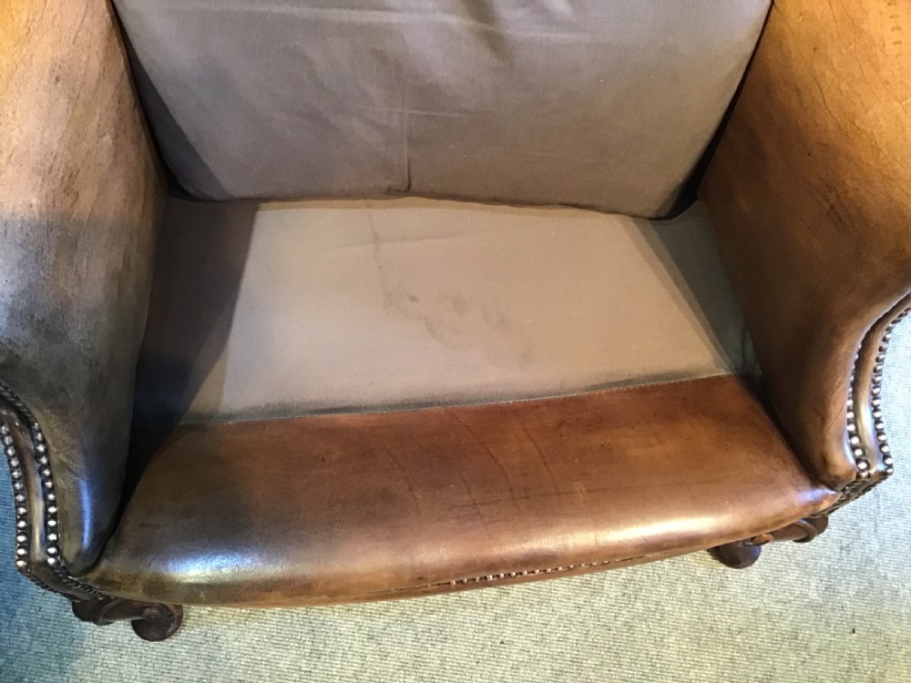 Antique leather wing chair View VIII
