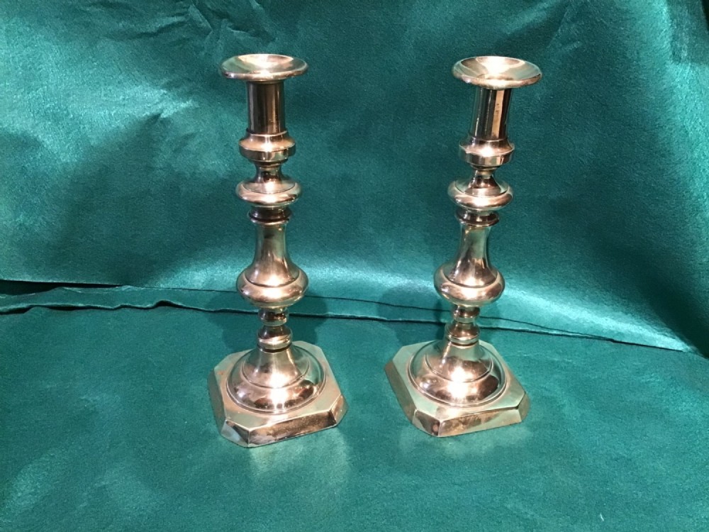 A pair of antique candlesticks