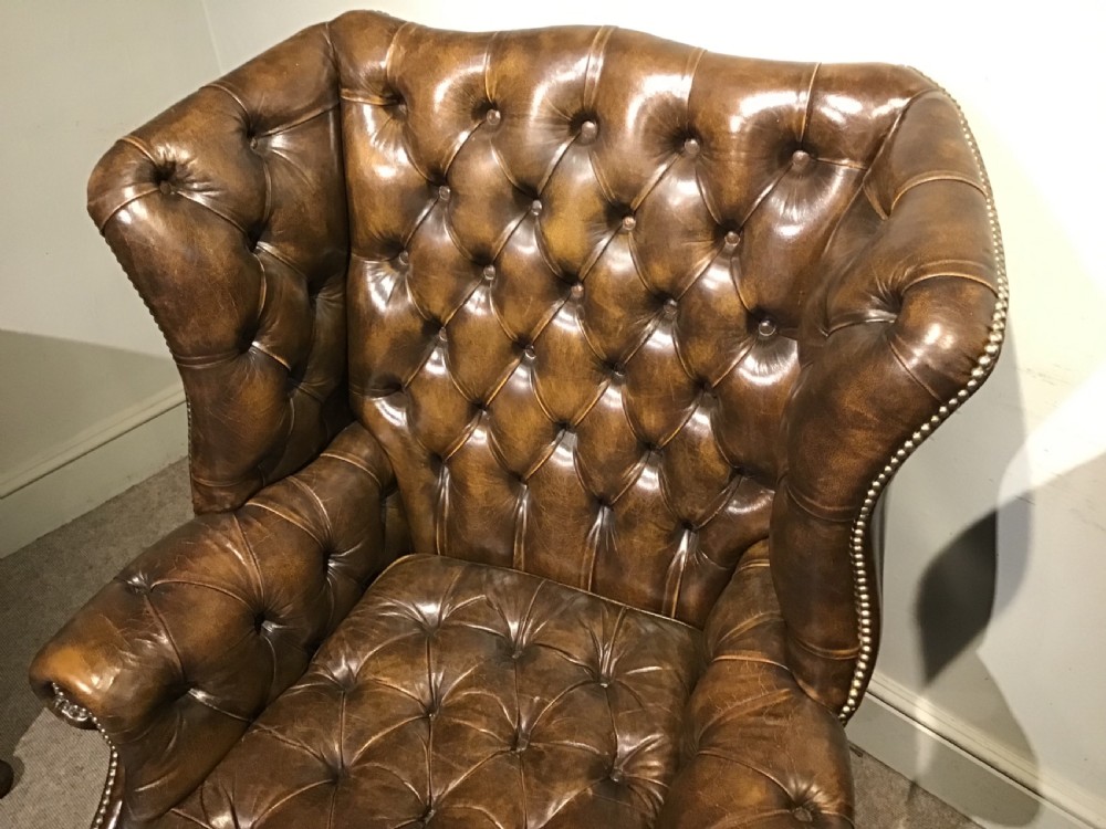 Pair of leather upholstered wing chairs View III