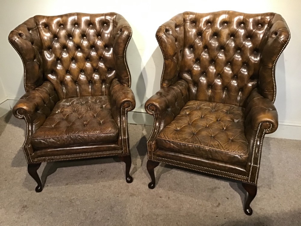 Pair of leather upholstered wing chairs View IV