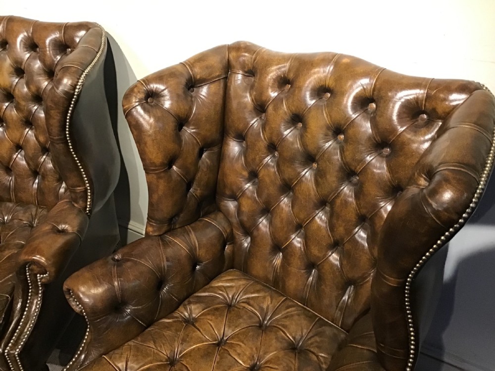 Pair of leather upholstered wing chairs View VI