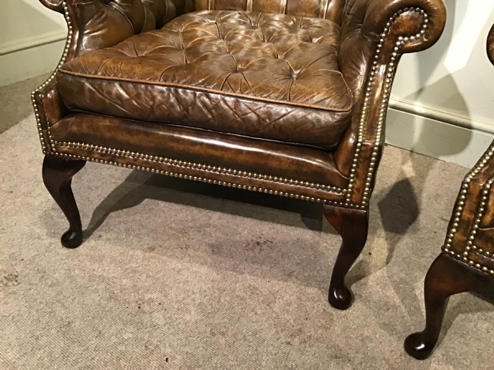 Pair of leather upholstered wing chairs View VII