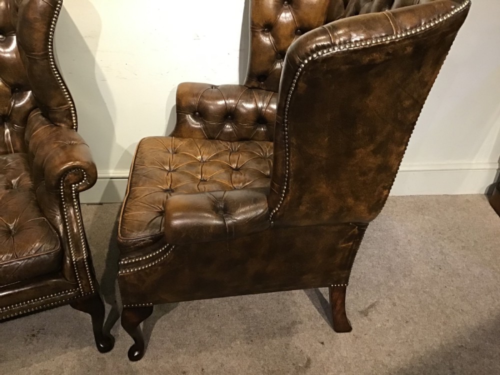 Pair of leather upholstered wing chairs View IX