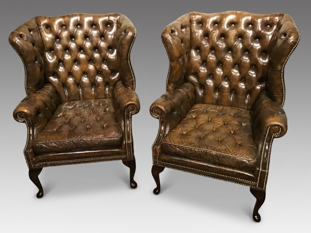 Pair of leather upholstered wing chairs View XII