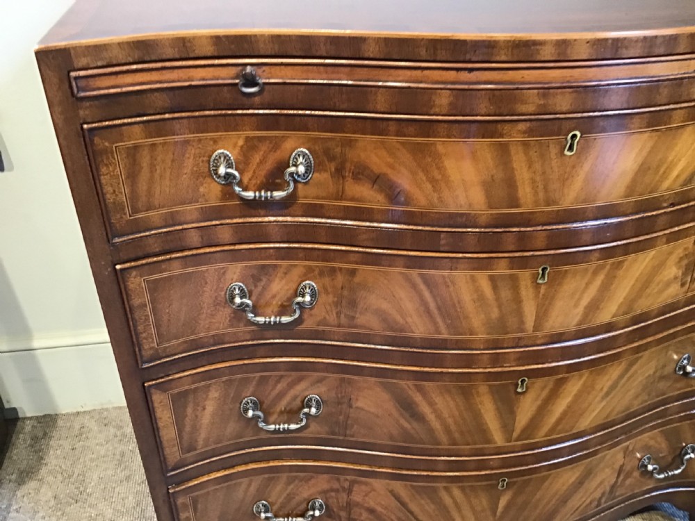 Antique serpentine chest of drawers View V