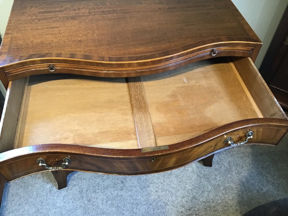 Antique serpentine chest of drawers View X