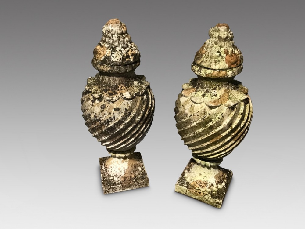 Pair of weathered terracotta urns