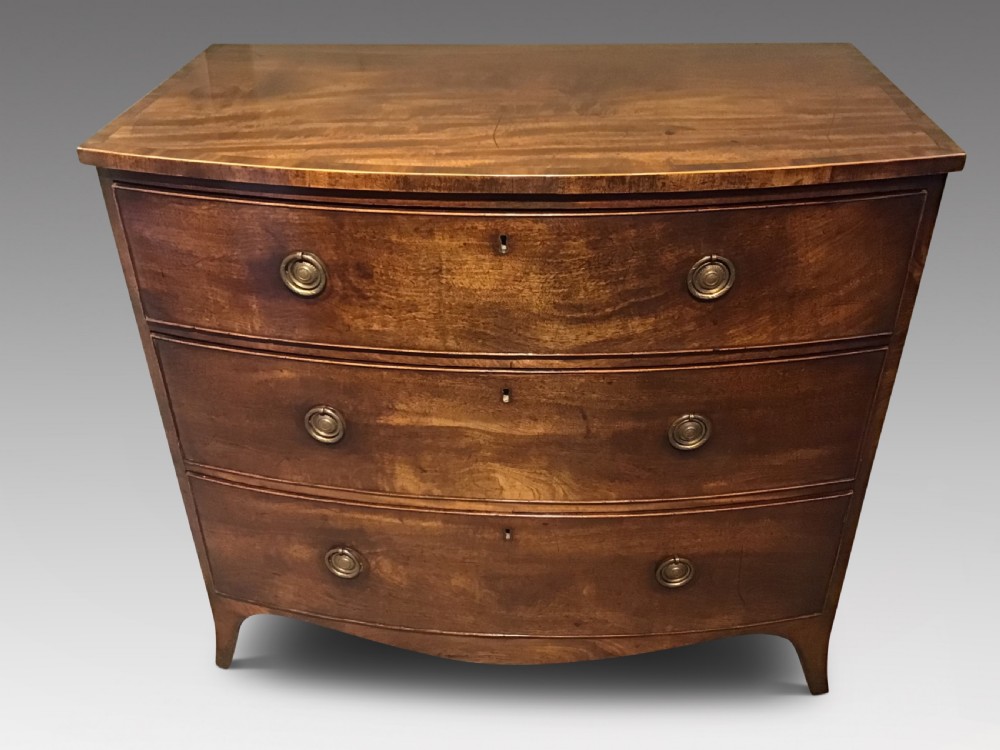 Antique bow front chest of drawers