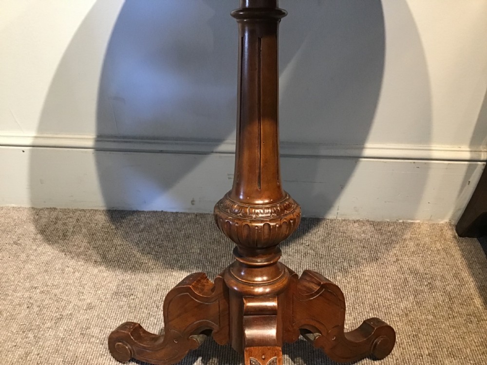 A Victorian tripod occasional table with a circular top featuring geometric specimen wood marquetry and a turned pedestal column. View V