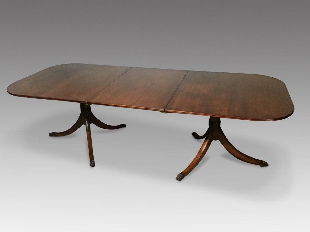 An antique mahogany dining table