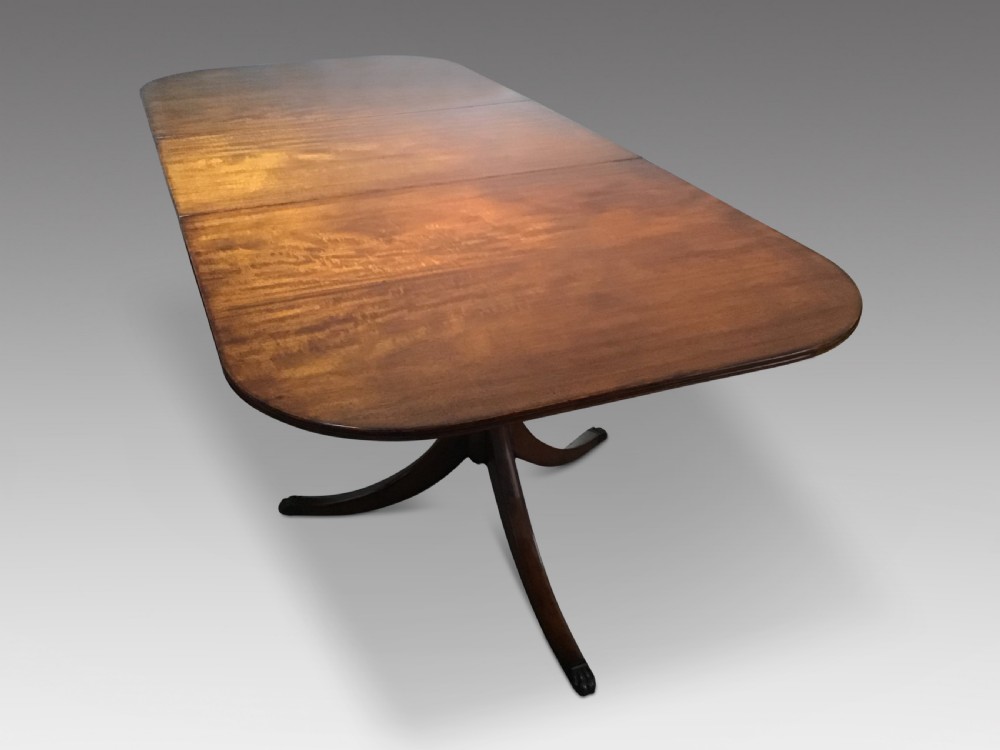 An antique mahogany dining table View II