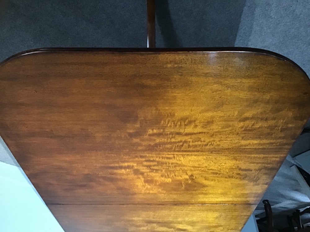 An antique mahogany dining table View III