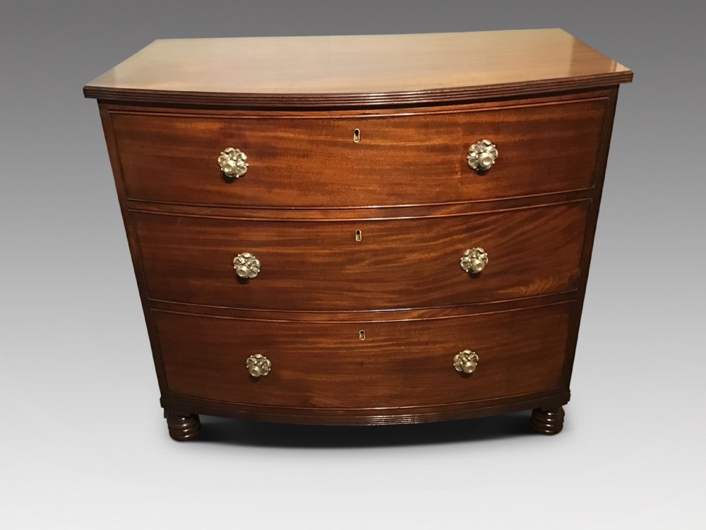 Antique bow chest of drawers
