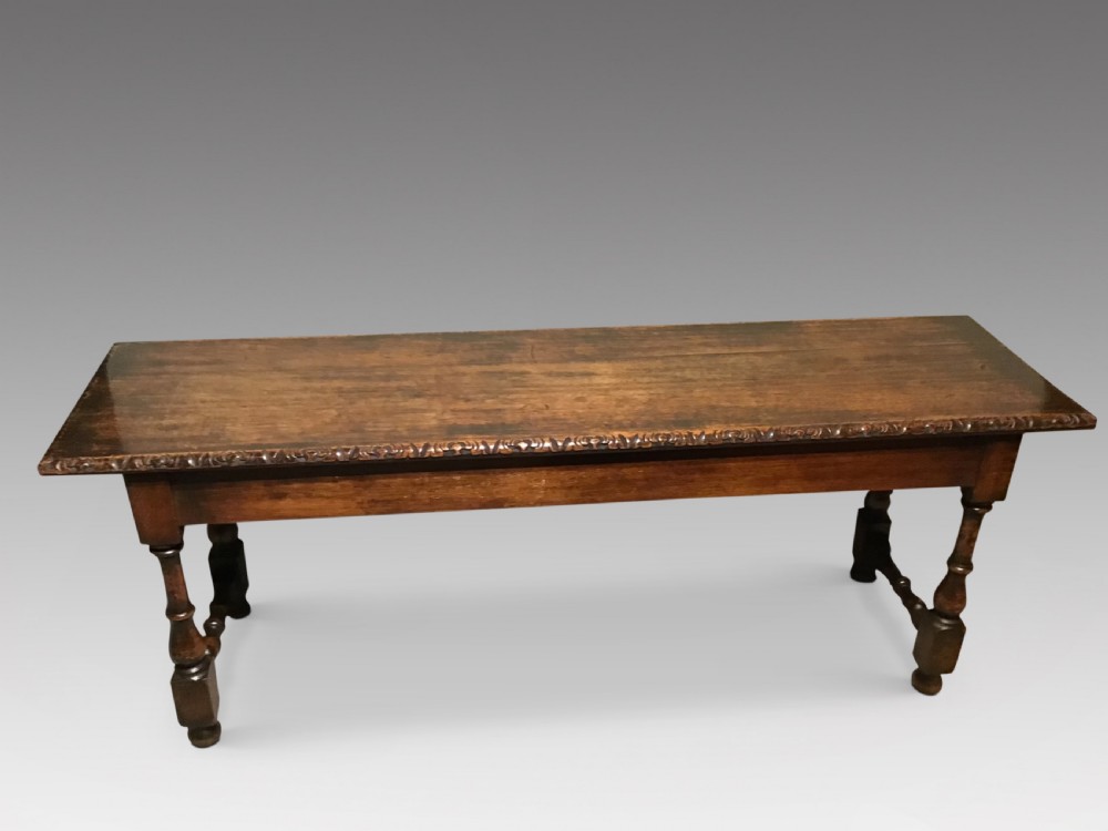 An antique oak hall bench