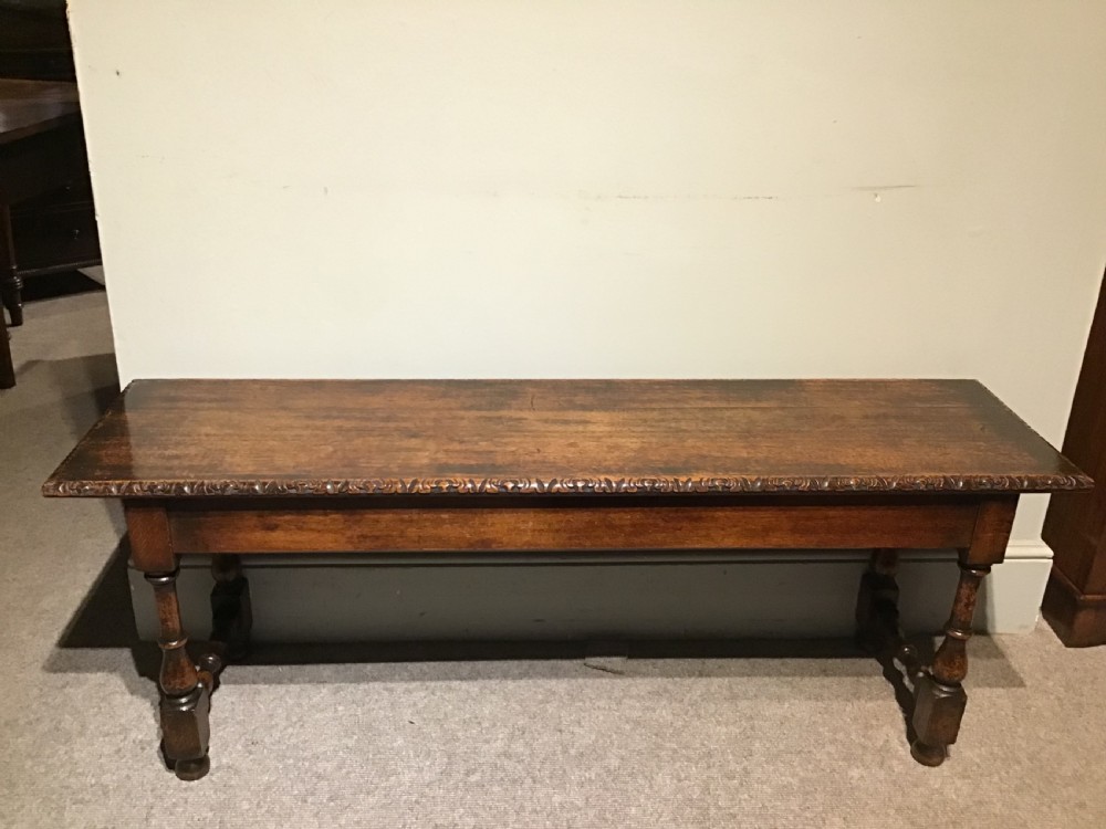 An antique oak hall bench View II