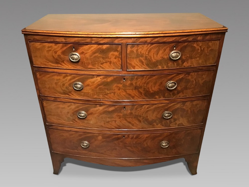 Antique bow front chest of drawers