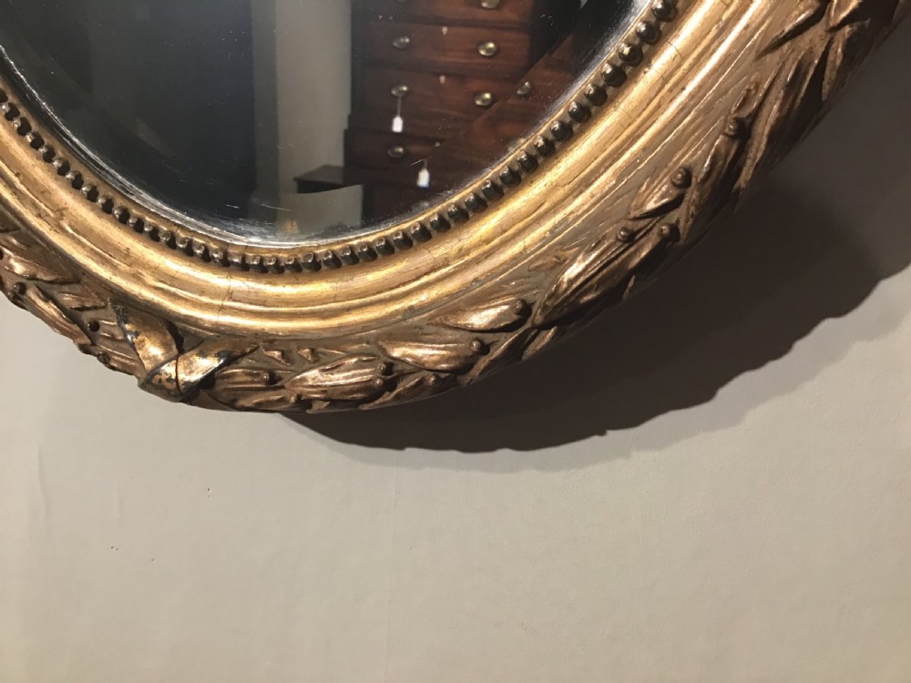 Antique oval wall mirror View II