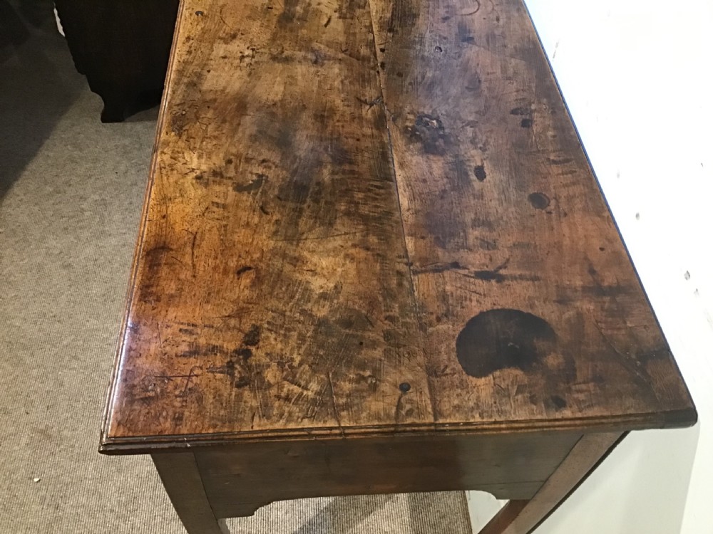 An 18th-century style antique walnut lowboy table featuring three drawers with decorative brass handles and fretwork corner brackets. View III
