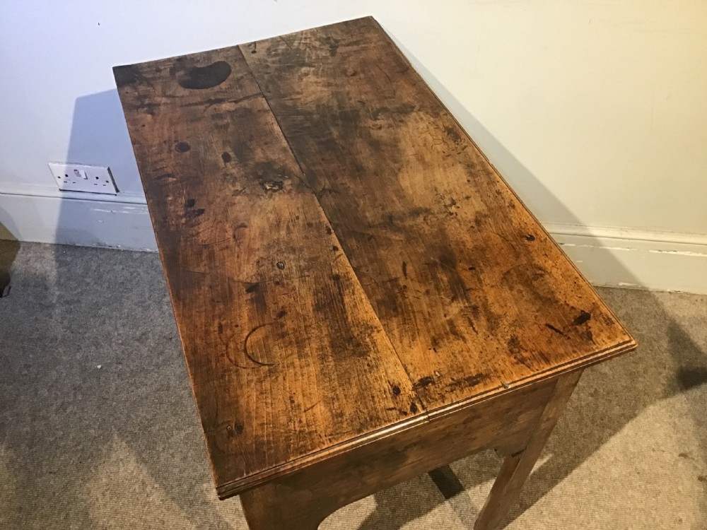 An 18th-century style antique walnut lowboy table featuring three drawers with decorative brass handles and fretwork corner brackets. View IX